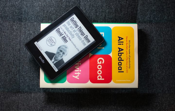 Picture of Kindle with Getting Things Done by David Allen, and Feeling Good Productivity book by Ali Abdaal