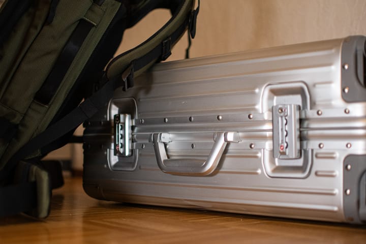 Image of a suitcase and a backpack